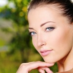 smiling woman touching her chin